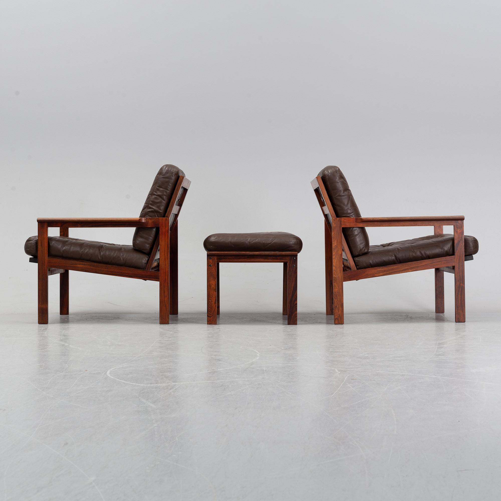 Illum Wikkelsö, a pair of 'Capella' easy chairs and one stool. Eilersen, Denmark. Designed 1959.