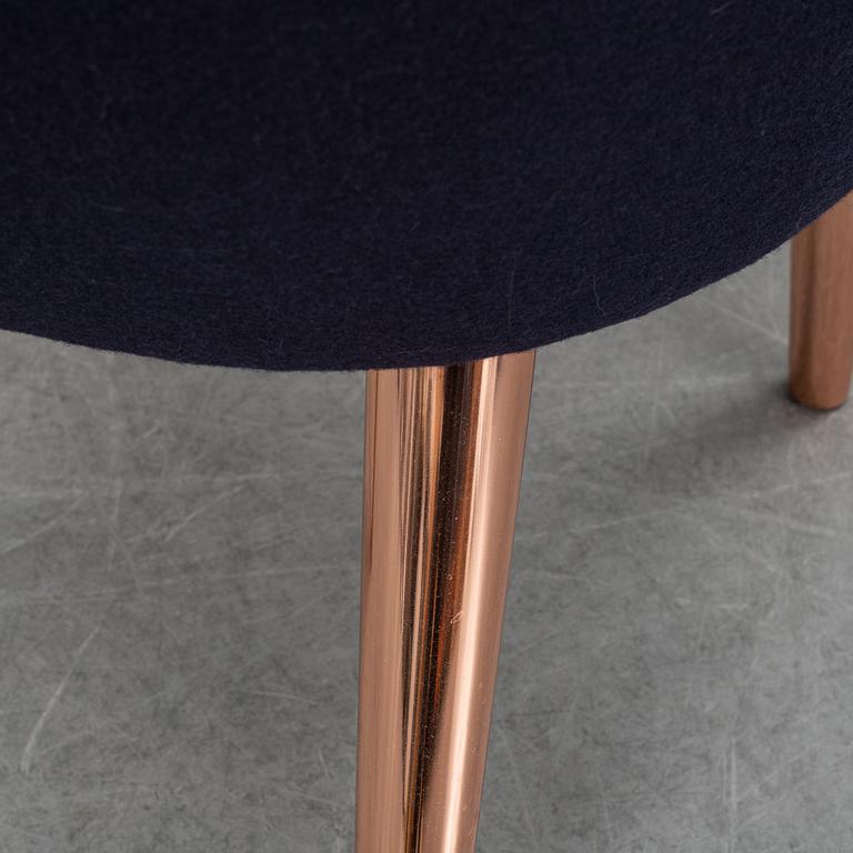 A Tom Dixon "Wingback Dining Chair" from Tom Dixon.