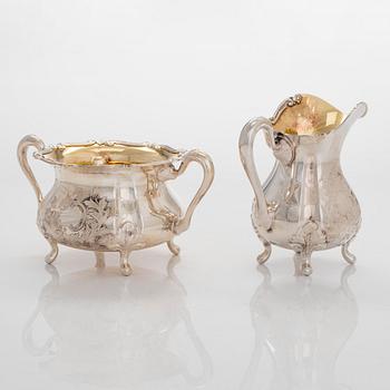 Sugar bowl, cream jug, pastry tong, and 6 coasters, silver, Auran Kultaseppä, Turku 1964-81.