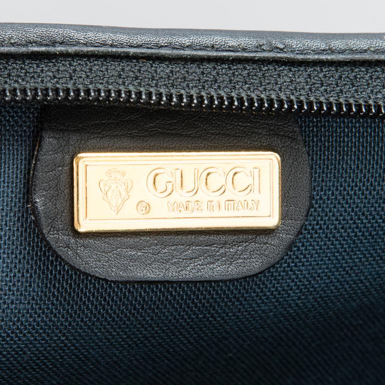 GUCCI, KLÄDÖVERDRAG SAMT VÄSKA, 1980-tal.