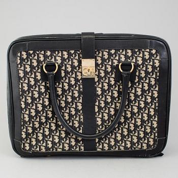 CHRISTIAN DIOR, a monogram canvas suitcase.