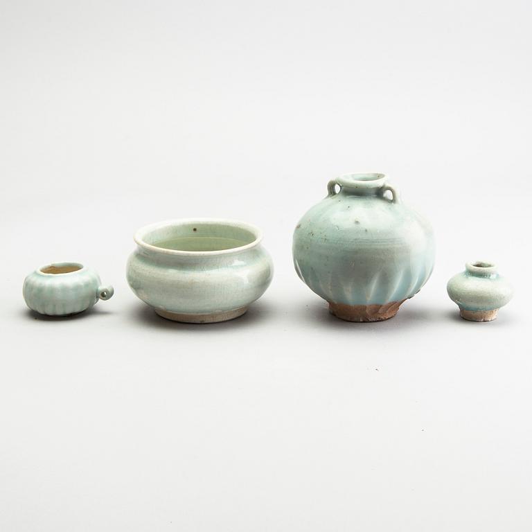 A group of four pale green glazed vessels, South East Asia, presumaby Sukothai, 14th/16th Century.