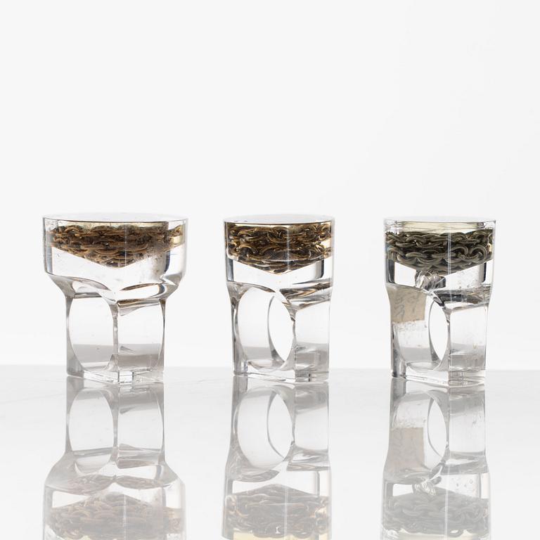 Siv Lagerström, three rings, acrylic plastic and chains. 1970s.