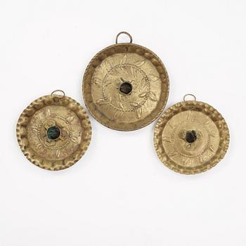 three brass candle holders from the 18th century.