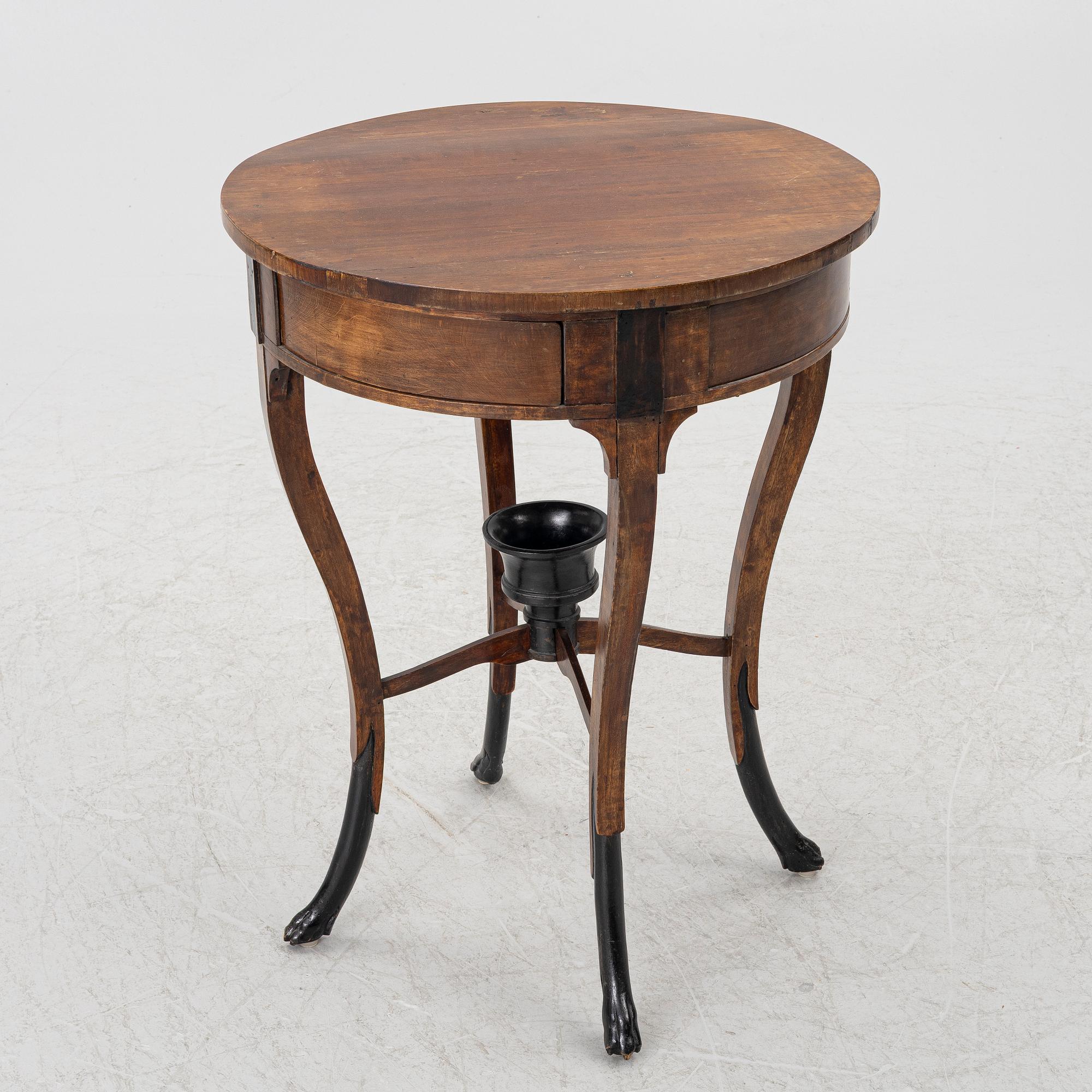 An Empire table, northern Europe, early 19th century.