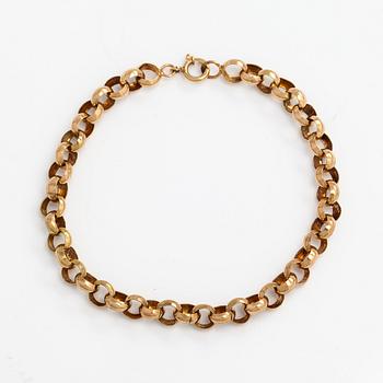 A 14K gold bracelet.