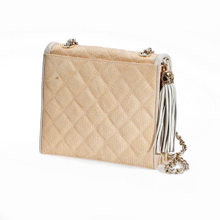 A beige shoulder bag by Chanel.