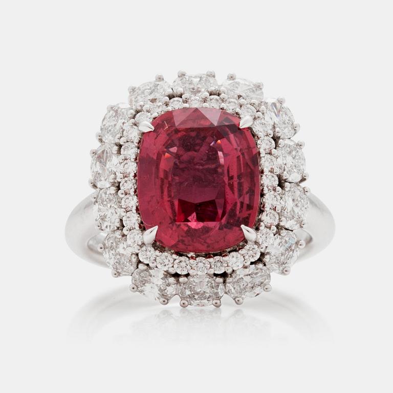 A 5.12 ct unheated red-orange sapphire and brilliant cut diamond ring. Total carat weight of diamonds circa 1.48 cts.