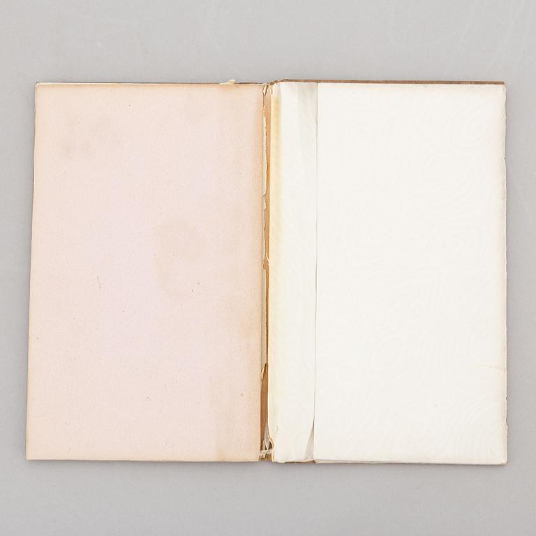 A keepsake book embellished by Ellen Jolin featuring a 'Santa Claus' figure.