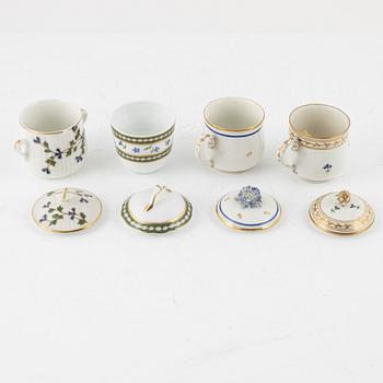 A set of nine Austrian and French custard cups with covers, 19th/20th Century.