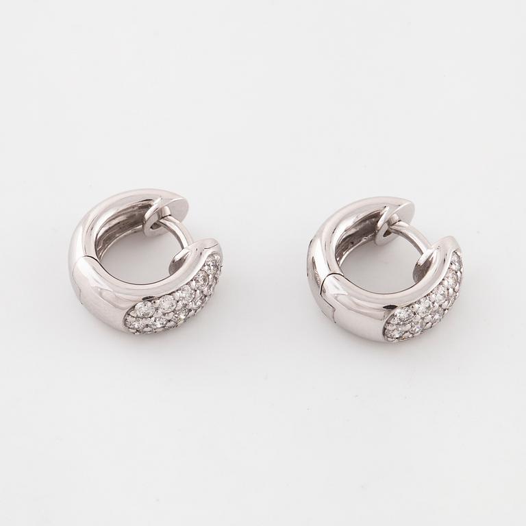 A pair of brilliant cut diamond earrings..