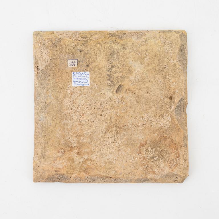 A Persian (Iranian) tile, glazed pottery, Qajar dynasty, 19th century.