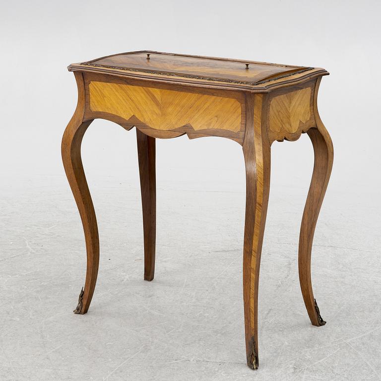 A Louis XV style table, circa 1900.