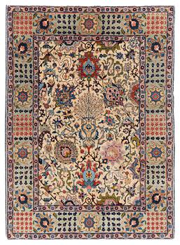 A signed semi-antique Tabriz rug, ca 198 x 142 cm.