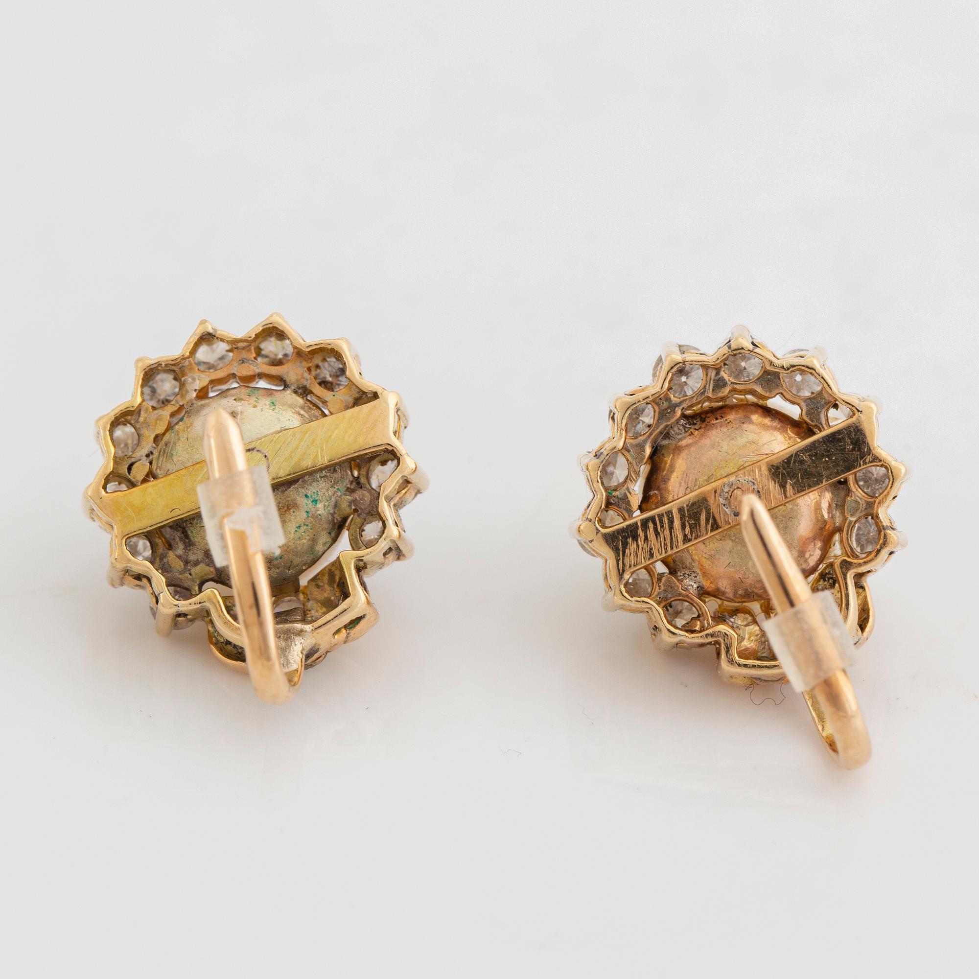 Cultured pearl and brilliant cut diamond earrings.