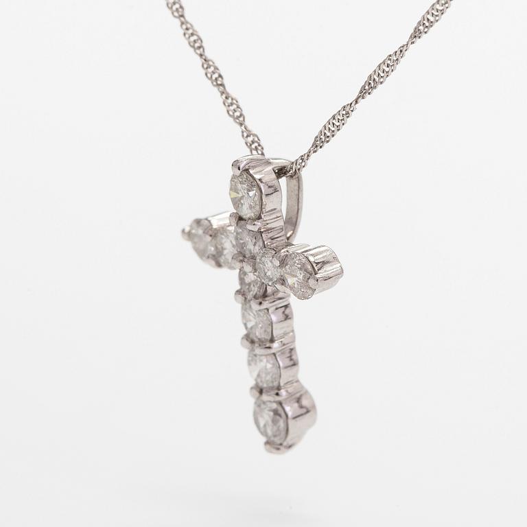 A platinum necklace with a cross pendant set with brilliant-cut diamonds 0.52 ct acording to engraving.