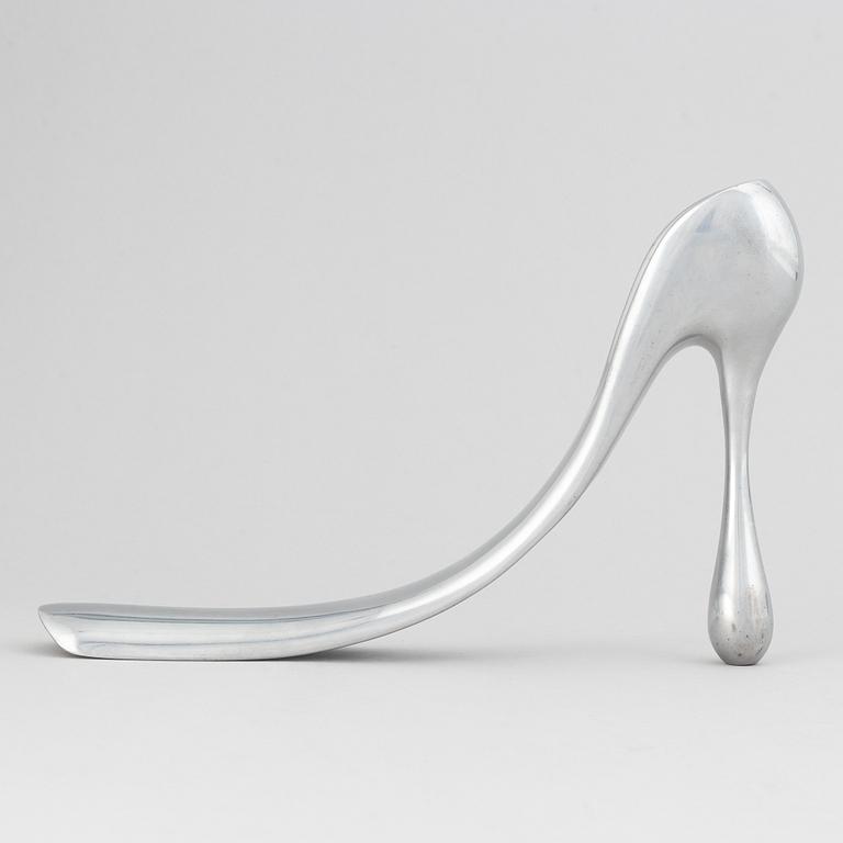 Manolo Blahnik, a metal shoe horn, 21st century.