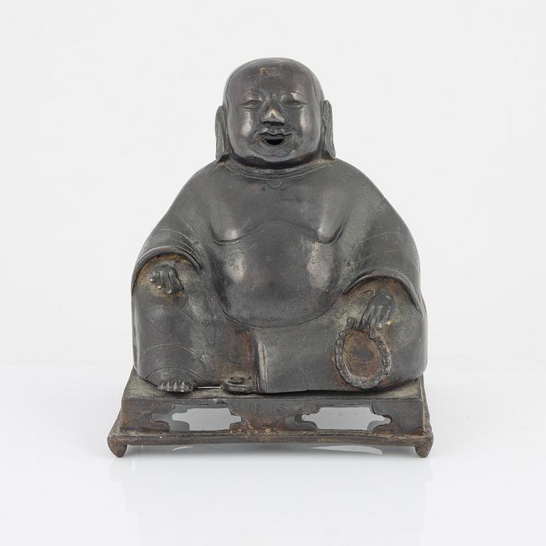 A bronze figure of Buddai, Qing dynasty (1664-1912).