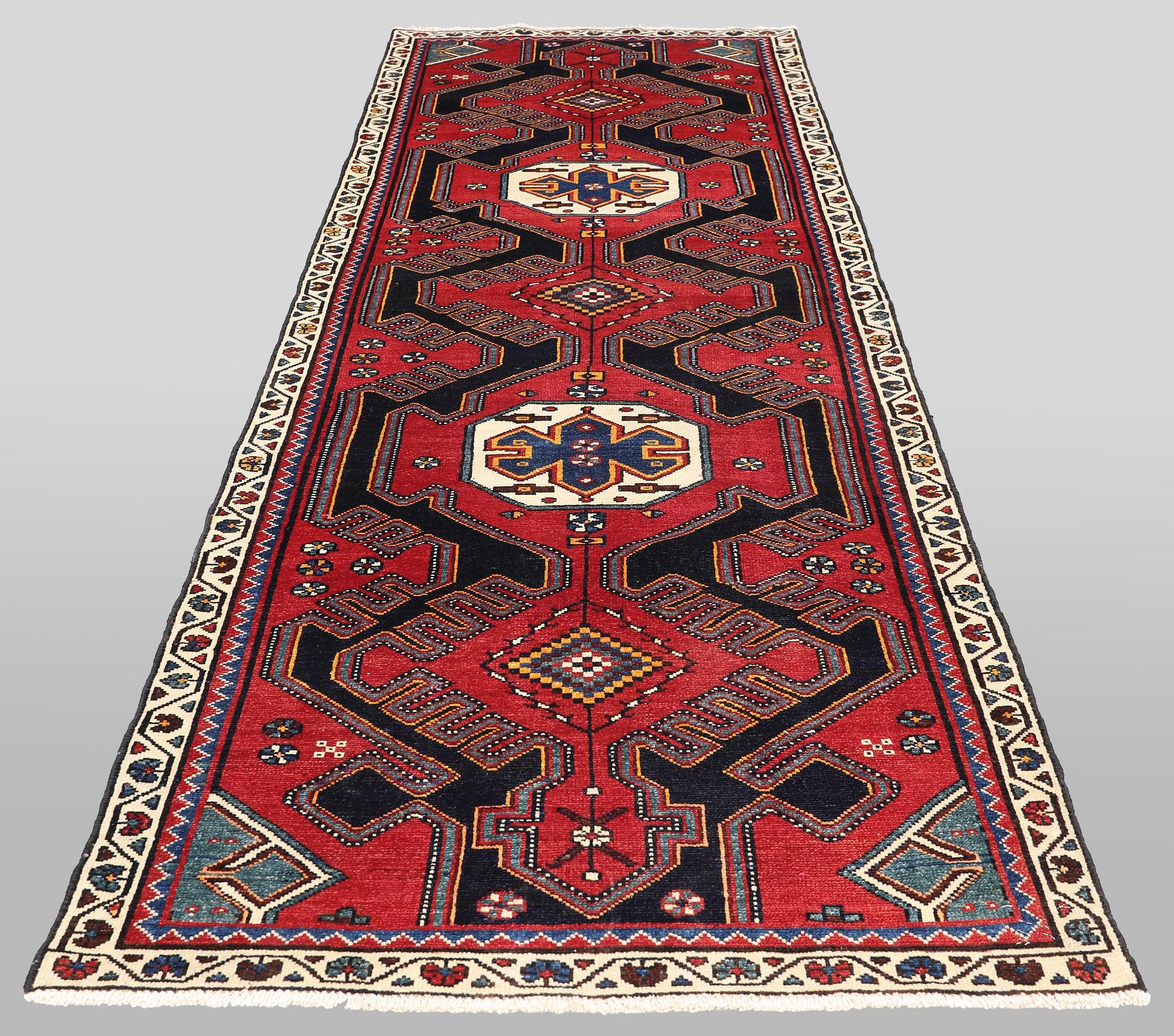 A semi-antique runner carpet, 295 x 100 cm.