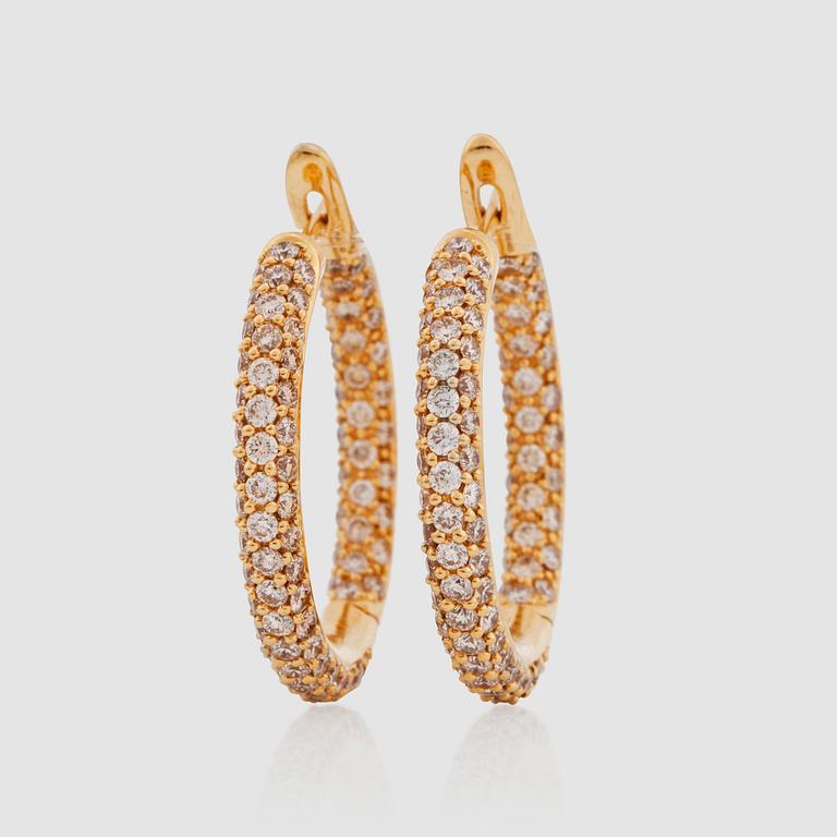 A pair of brilliant-cut hoop earrings. Total carat weight circa 3.29 cts.