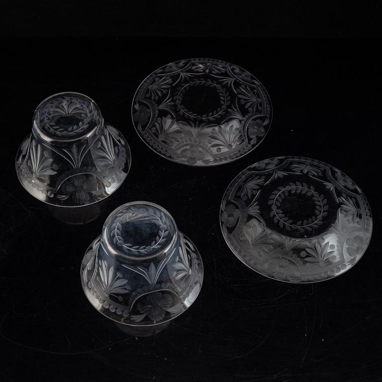 A pair of glass bowls with dishes, 20th century.