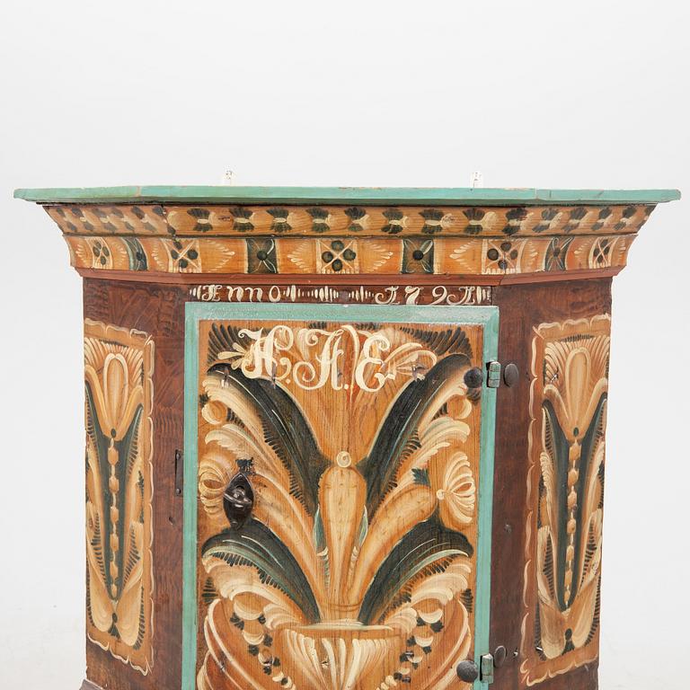 A Swedish painted corner cabinet dated 179?.