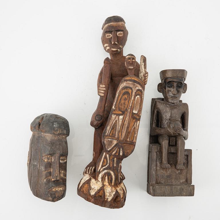 A set of three wooden Asmat sculptures, Indonesia, Jakarta, 20th Century.