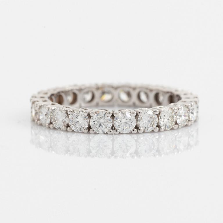 Brilliant cut diamond eternity ring.