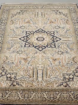 A silk Qum carpet, around  219 x 137 cm.