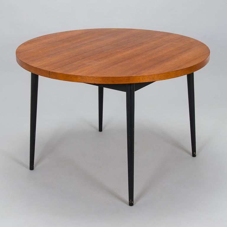 A mid-20th century dining table.