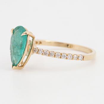 Pear shaped emerald and brilliant-cut diamond ring.