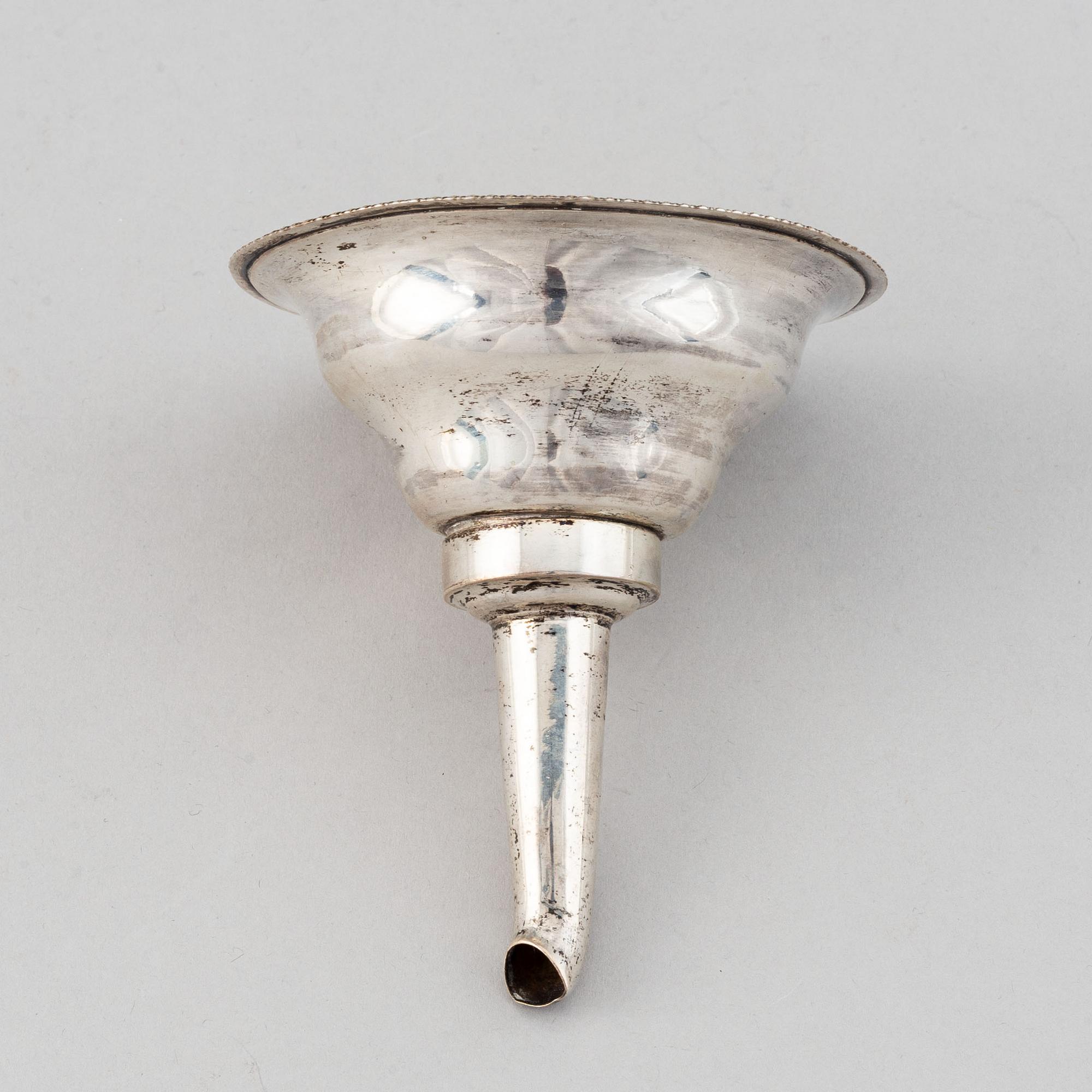 A Swedish 19th century parcel-gilt silver wine-strainer, mark of Adolf Zethelius, Stockholm 1839.