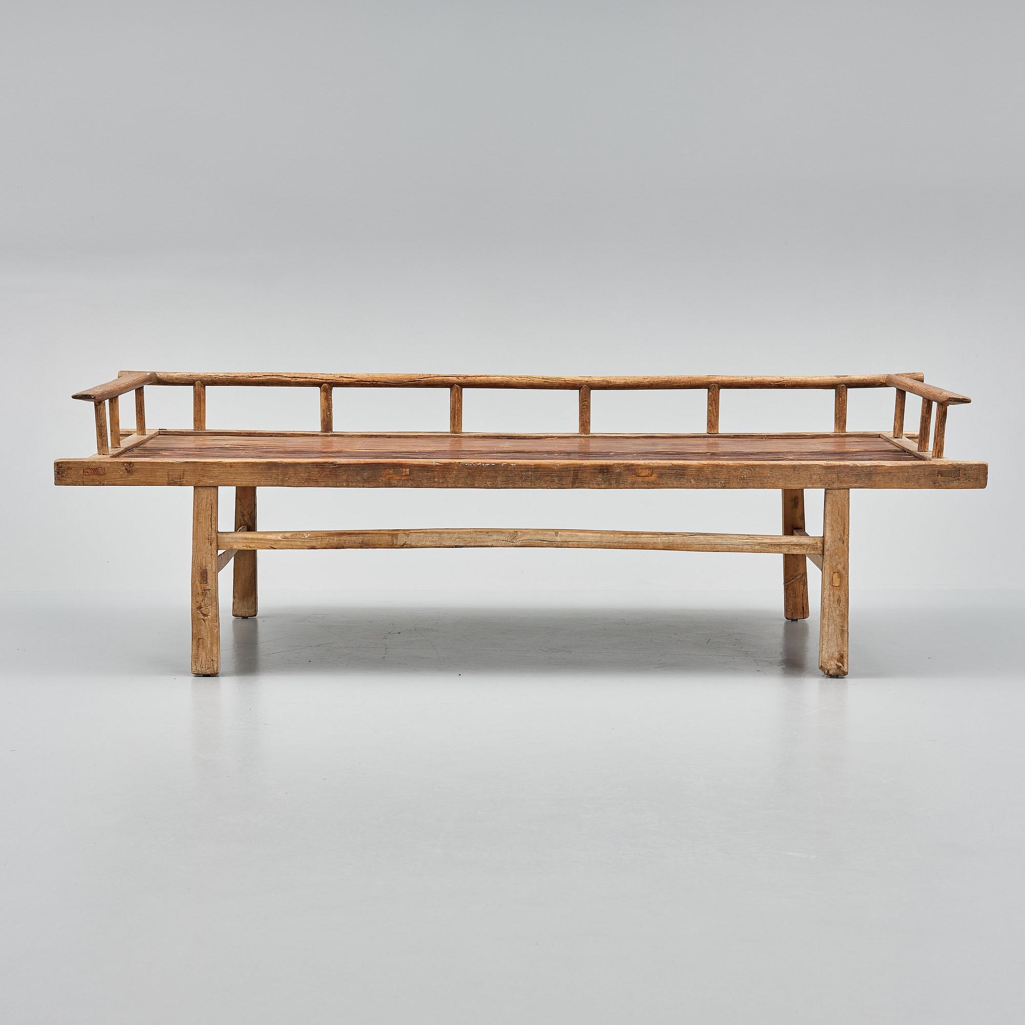 A wooden daybed, South East Asia.