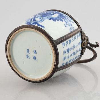 A metal mounted porcelain ewer, late Qing dynasty.