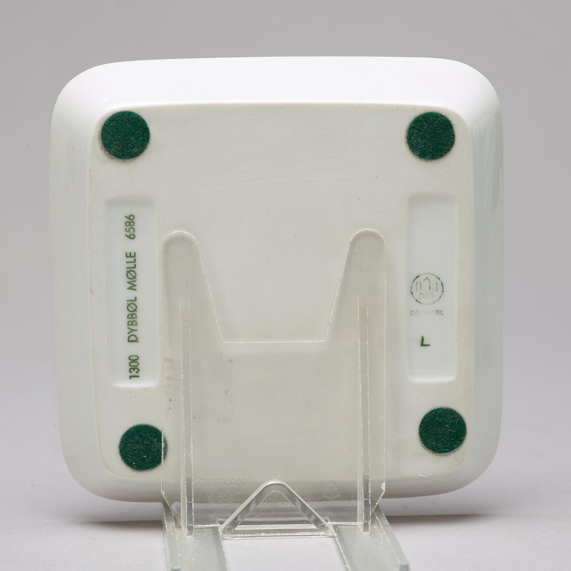 BING & GRÖNDAHL and ROYAL COPENHAGEN, a set of three porcelain vases and a dish, Denmark.