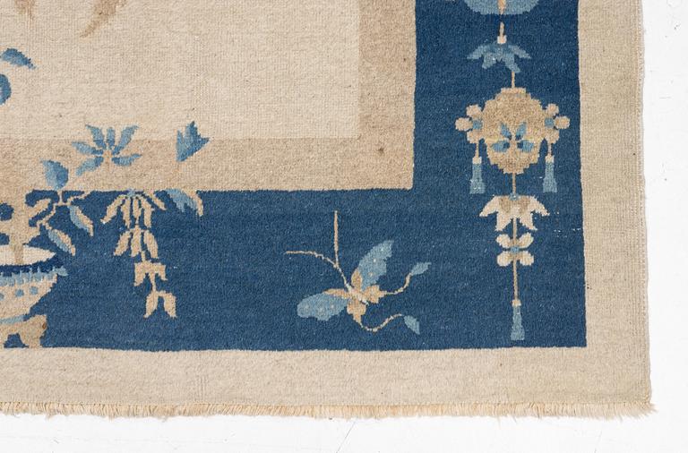 A semi-antique China/Nepal carpet, c, 385 x 297 cm.