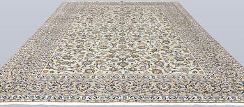 A Keshan carpet, signed, 397 x 302 cm.