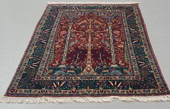 A rug, a semi-antique Esfahan figural part silk, ca 222-227,5 x 128-135,5 cm.