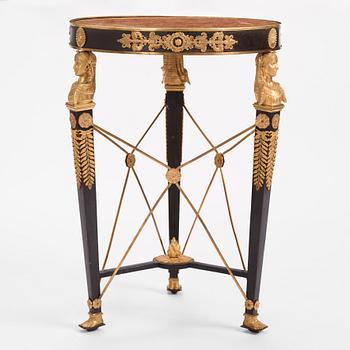 A French Empire-style gilt and patinated bronze  gueridon, later part of the 19th century.