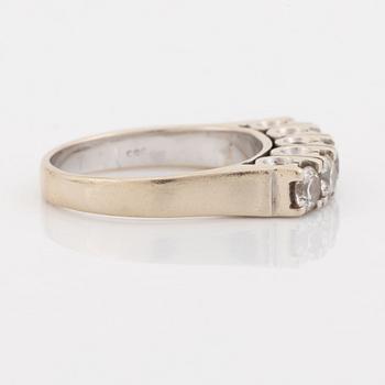 A 14K gold ring set with round brilliant-cut diamonds.