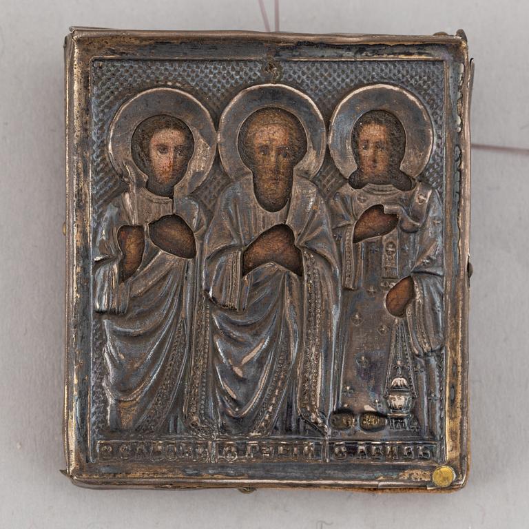Two Russian 19th century travle icon, oklad in silver and parce-gilt, one with assayer mark AA 1890.