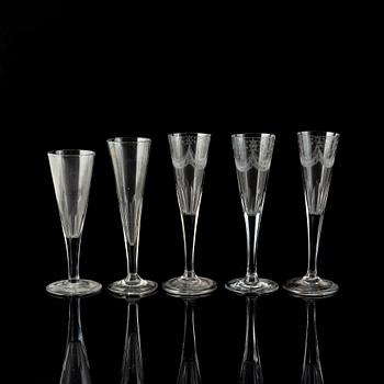 Five antique champagne glasses.