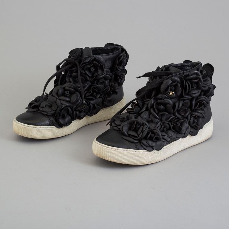 A black leather sneakers by Chanel.