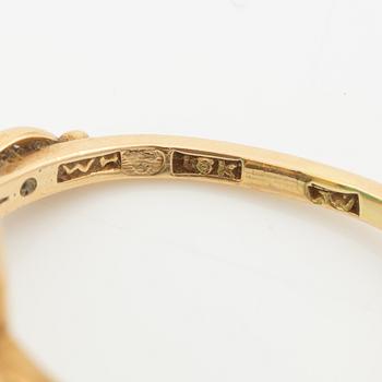 Ring 18K guld med grön sten.