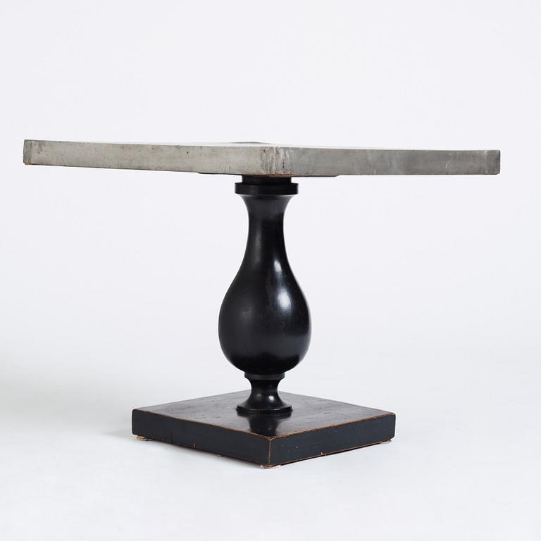 Uno Åhrén, a black lacquered table with a pewter top by Nils Fougstedt, Svenskt Tenn ca 1930. Alva & Gunnar Myrdal Collection.