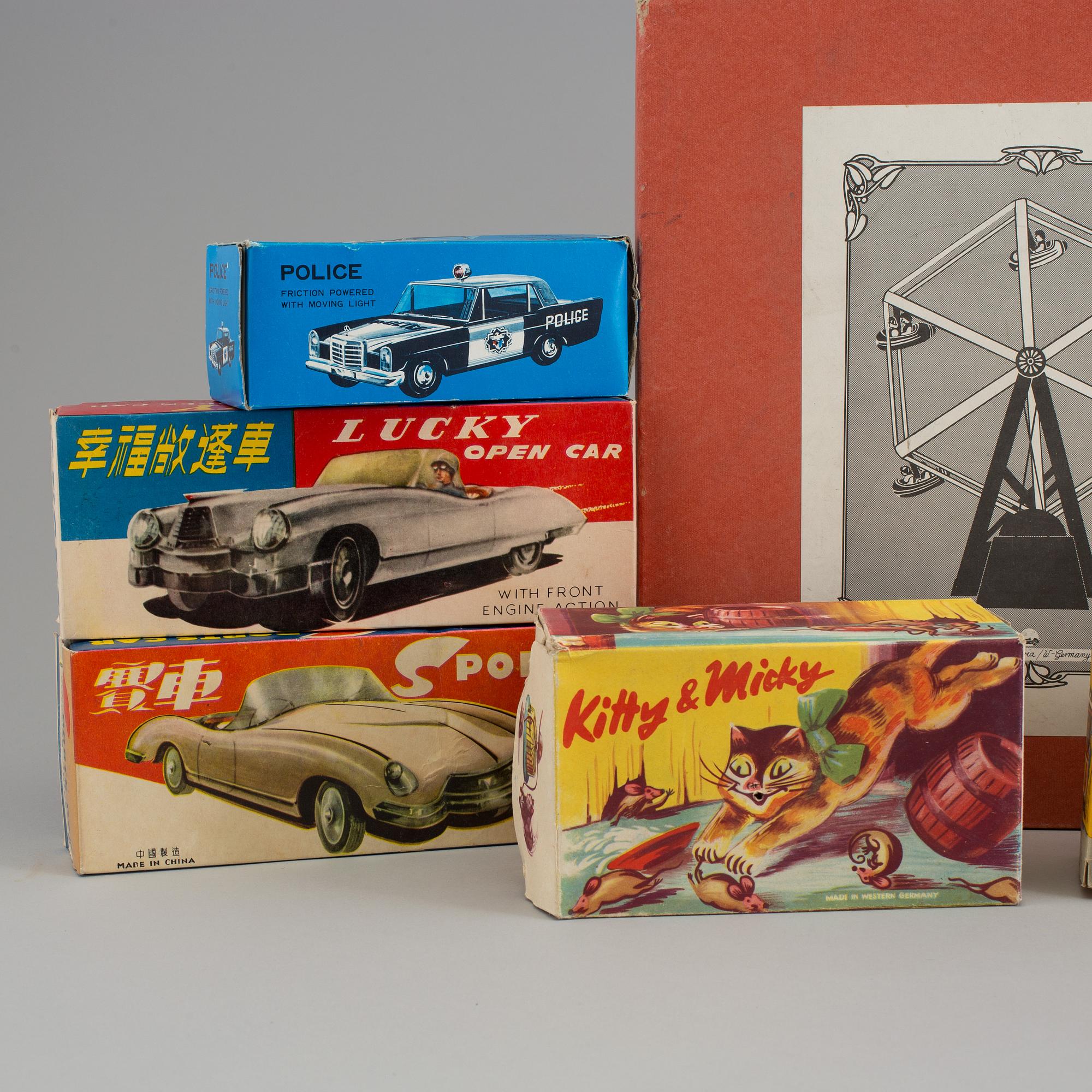 A lot of eight tinplate toys late 20th century.