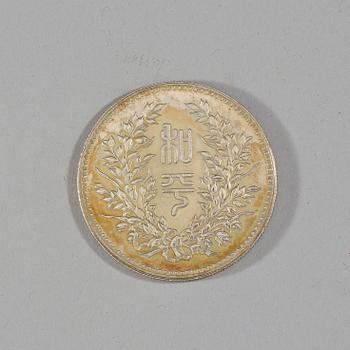 A box with five silver coins, Republic, early 20th Century.