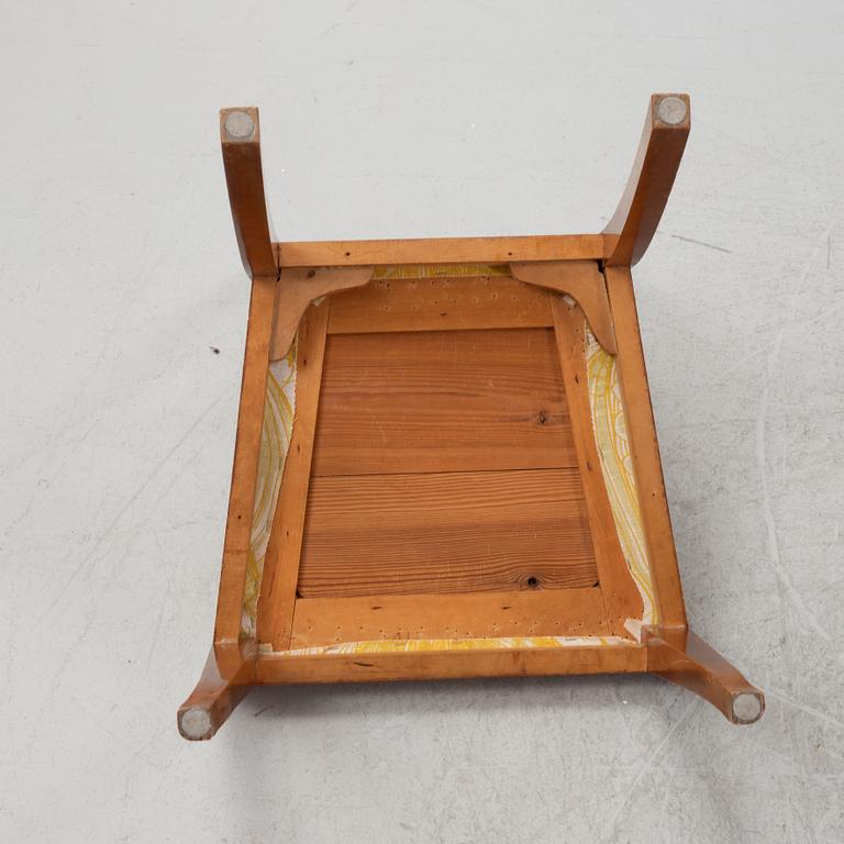 A birch veneered dressing table with two chairs.