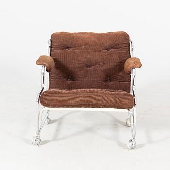 A 1970s chrome easy chair.