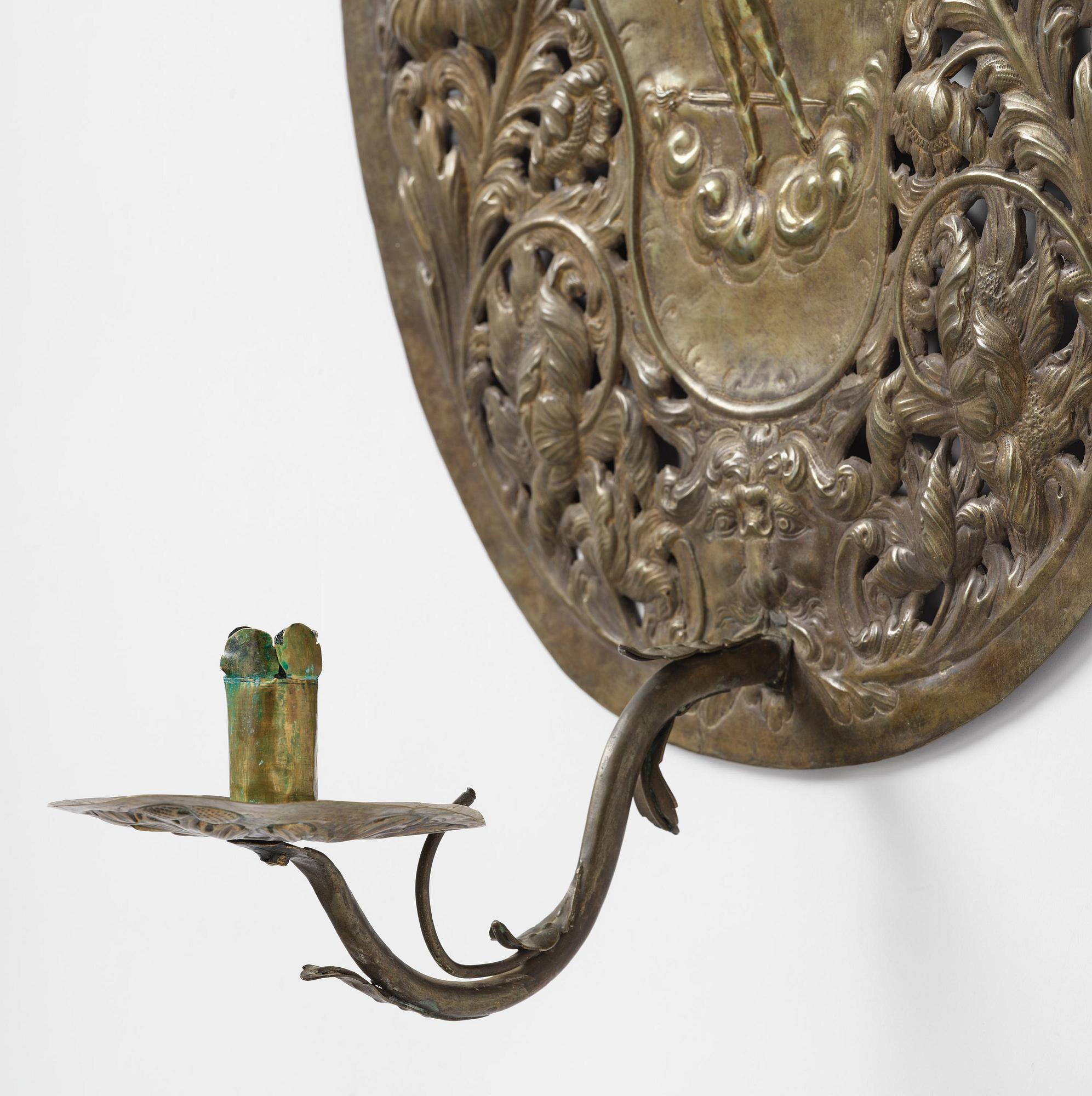 A set of four Swedish Baroque repoussé silvered brass reflector one-branch reflector plates, ca 1690-1700.